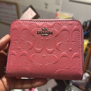 Coach Pink Leather Wallet with Embossed Pattern and Zipper Closure